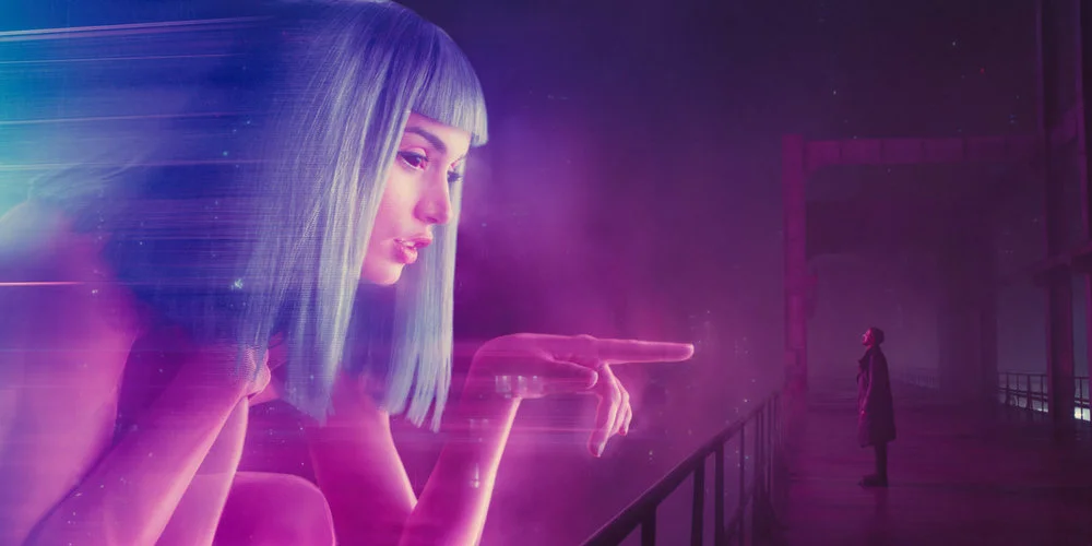 Ryan-Gosling-and-Giant-Hologram-in-Blade-Runner-2049.webp