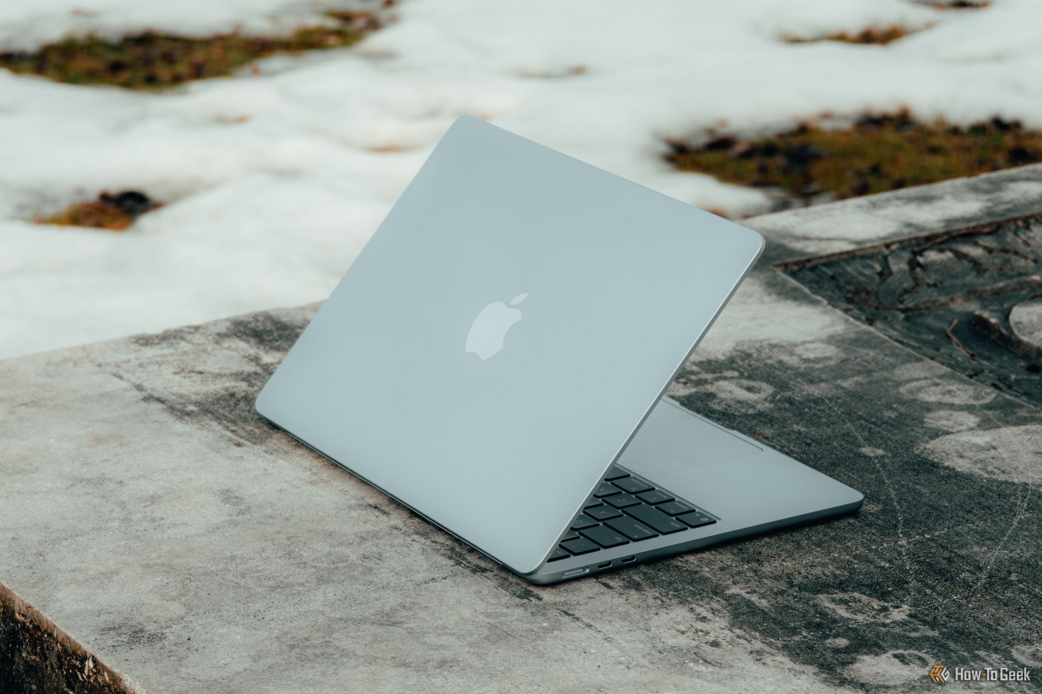 m4-macbook-air-in-sky-blue-angled-on-concrete-bench.jpg